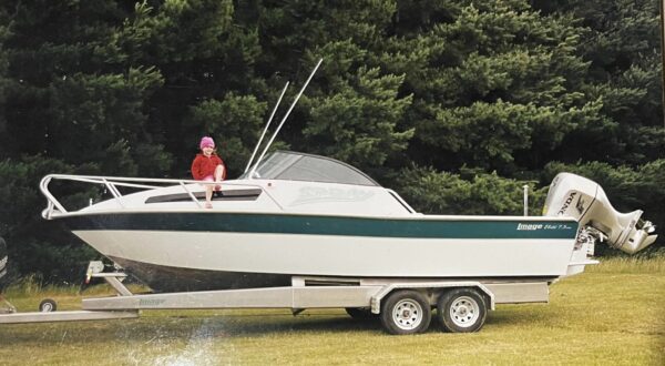 Image Boats NZ child sitting on boat