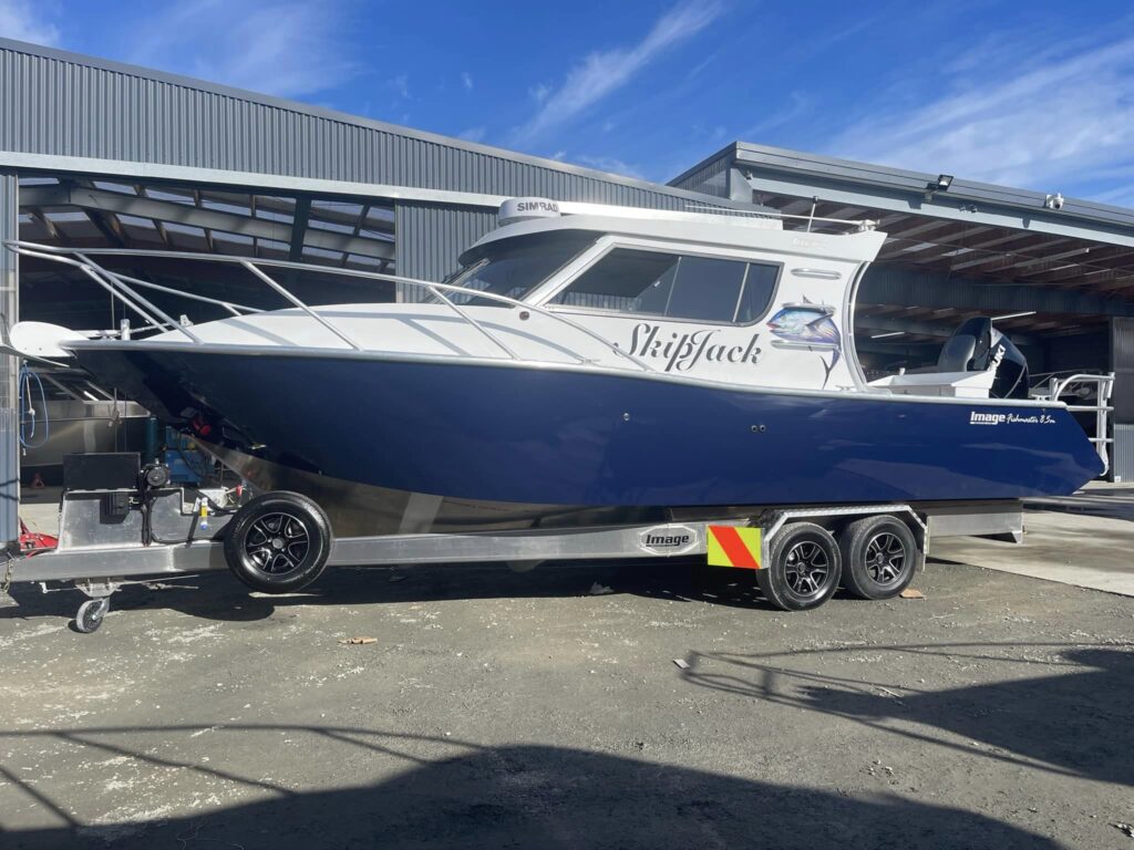 Image Boats New Zealand Skipjack boat on trailer